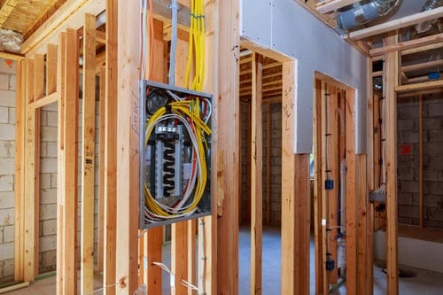 Residential electrical panel installed in new wall framing